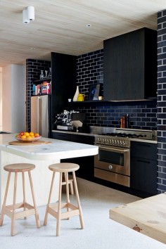 Charcoal glazed bricks in kitchen.