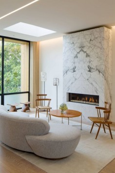 Cow Hollow Residence by Larson Shores Architects - Love the book-matched stone on the fireplace