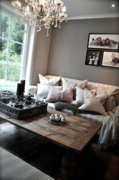 Cozy Neutral Living  the picture placement over the sofa feels off to me.