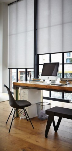 Create a working style in an urban home office with a striking black and white simplicity and roller shades. ♦ Hunter Douglas window treatments