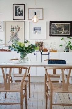 Dining table and sideboard styling: gallery wall, green plants, flowers, simplicity, personal objects. Love it!