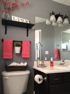 Even the most bland of bathrooms can be made bright with pops of color from towels and bath accessories.