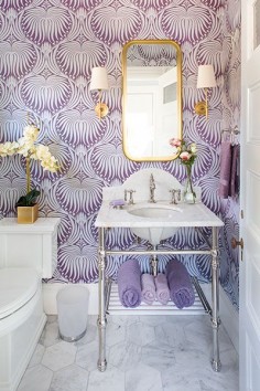 Farrow & Ball's Lotus Pattern 2062 provides a dramatic backdrop for the Palmer Industries console sink in the powder room of Belmont Project House.