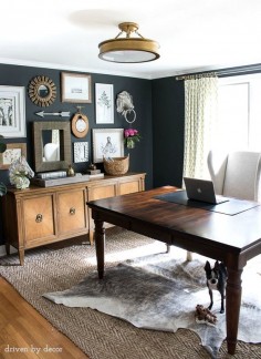 Home office with charcoal gray walls and eclectic gallery wall above a credenza. Post includes full source list!