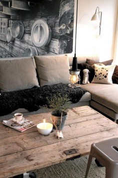 ¹ huge photographic print adds major depth to the small space ² old wooden plank door as a rustic coffee table ³ sectional sofa ♥ winner