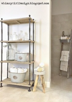I love using unconventional items for everyday use. Finding a solution for towel access proved to be daunting due to a tiled wall that leads into our walk-in shower. I discovered this old, chippy ladder at an antique store and knew it was the perfect solution for the corner. I hung a galvanized bucket on the top to hold washcloths and used the other bars for bath towels. Problem solved!