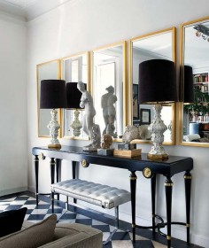 Inside an Apartment That's Black and White and Chic All Over// Mirrors, black lampshades, marble floors