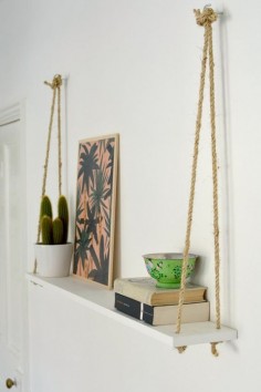 Just three ingredients (rope, two hooks and a painted shelf) are all it takes to construct this easy DIY rope shelf.