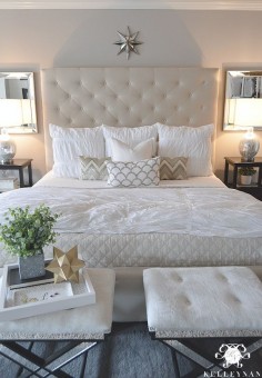 Kelley Nan: Master Bedroom Update- Calming White and neutral master bedroom with tufted ottoman stools, Pottery Barn Tall Lorraine Headboard, Diamond linen quilt and hadley ruched duvet