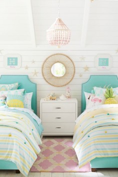 Let the bright colors of summer shine all year long with blue upholstered beds and cool yellow bedding that have subtle touches of the beach. Pair with rattan accessories and pieces of the tropics like flamingos and pineapples to complete the look.