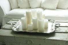 love white candles on silver  on the list for the living room fireplace