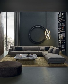 Low sofa looks modern, but overstuffed pillows make it comfortable. Super sexy space.