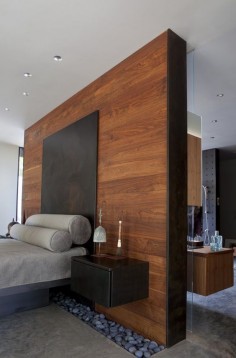 Luxurious wood texture + brilliant idea with small stones near the wall #minimalist #bedroom Heavy Metal by: Hufft Projects  Joplin, United States