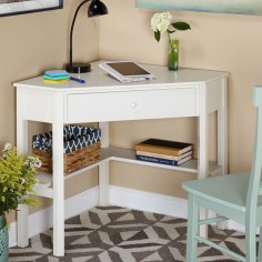 Make the most of your square footage with this white wood corner computer desk that is perfect for a kids room. This desk has enough room for doing homework or working on a laptop while conserving space by taking up just one corner of your room.