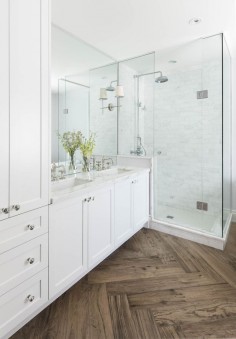 Master bathroom with herringbone wood floor, marble shower and countertops, white cabinets, double vanity | Ali Budd Interiors