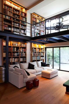 modern contemporary living room with mezzanine/library