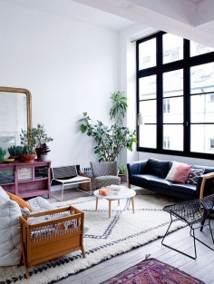 modern living room with tall ceilings and black framed grid windows photographed by julie ansiau. / sfgirlbybay