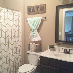 My kids bathroom is perfectly small with just enough room for the necessities. I wanted to spruce it up a bit but still keep it gender neutral so I bought this gold herringbone shower curtain from @Target and the bath letters from @Magnolia Market that I attached to a piece of reclaimed wood. Now all I need to do is to paint a target in the bottom of the toilet. Maybe my boys would try harder to get it IN the bowl that way. #magnoliamarket #targetstyle