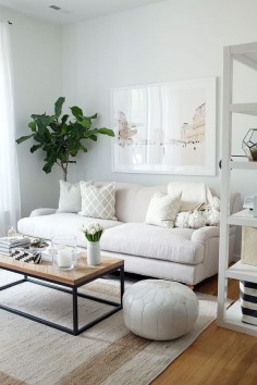 neutral living room, English roll arm sofa, oversized art