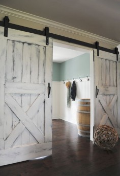 Nothing says farmhouse style quite like barnwood doors! We love these country-chic sliding doors for inside the home.