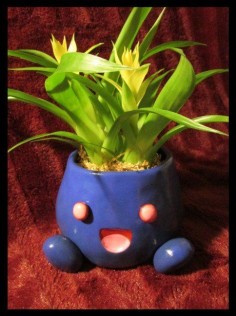Pokemon Oddish Planter. This would look adorable with an Aloe Plant in it!