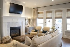 Private Residence Interior Design by Alice Lane Home Collection. (open concept, bright, white, slipcover, mantle, mounted tv, oly, tufted bench, armchairs, task light)