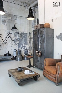 Quintessential mix of industrial and antique - vintage leather club chair next to industrial metal lockers #interiors #design #architecture