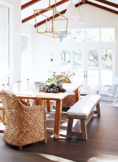 Rustic dining space with a farmhouse table and large gold lantern