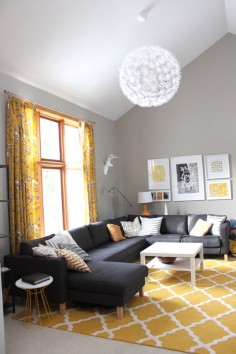 / sherwin williams mindful gray + tall ceilings! I love this couch but I'm not a fan of the yellow accent pieces! I think it would look a lot better with cooler colors!