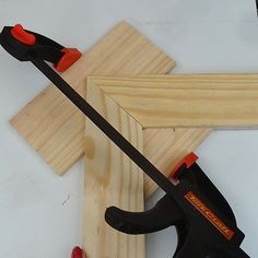 Simple picture frame clamp holderAll you need is a carpenter's square or steel corner to use as a guide for cutting perfect 45-degree cut outs.