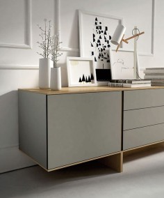 Simple yet wonderfully effective. Taupe sideboard with minimal white accessories against white panelled wall. Cool, contemporary and utterly charming.