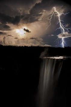 Striking: Lightning bolts through a cloud over Kaiteur Falls on the Potaro River