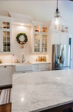subway tile kitchen - marble counter. Cottage  a bit more color, but I like it.
