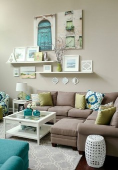 teal + lime living room // love the wall display. Canvases plus shelves.