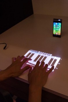 The Lenovo Smart Cast phone takes the concept of the digital piano to the next level with it's laser projection keyboard
