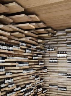 The walls, floor and ceiling of this store in Paris by Melbourne practice March Studio are covered by 3,500 pieces of wood.
