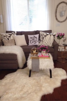 These furniture pieces all came from HomeGoods! The faux fur ottoman is fun and useful as a footstool or as a coffee table. The little gold mirrored side table is great anywhere and can be moved around easily to suit any purpose. The grey sofa is a fantastic find! It is neutral in color and can be easily decorated. By just changing a couple pillows and a throw this neutral sofa goes from light to dark alternating the room's mood in seconds. (Tap pic/read it to see these photos) Sponsored