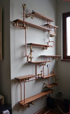 This copper pipe bookshelf. | 18 Steampunk Decor Flourishes That Will Make Any Room Badass