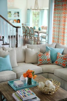 This is a very modern color scheme: Soft beige and baby blue are the two main, classical colors but the orange accents update the look. Gold is the 'surrpise' color.