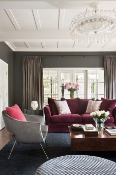 This living room ambience is a stunning combo of burgundy and gray velvets. The 2 seat sofa and the armchairs are a contemporary version