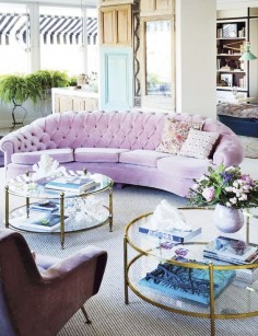 Tour a Sophisticated and Chic Spanish Home// pink tufted sofa, stripe awning, round coffee table, coffee table styling