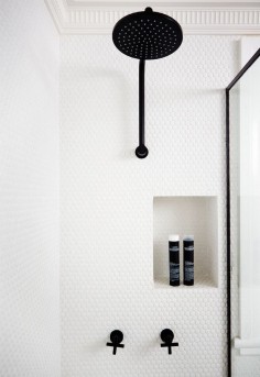Transitional #bathroom with white penny #shower tile + black fittings