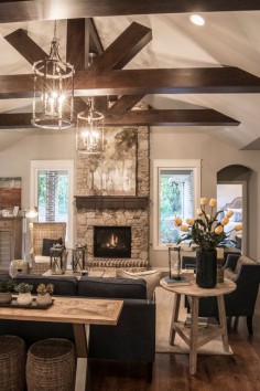 Transitional Living Room with High ceiling, metal fireplace, Carpet, Pendant light, Exposed beam, Hardwood floors