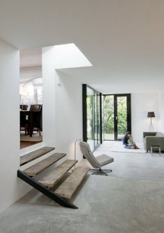 UP interiors — Living space with concrete floor and 