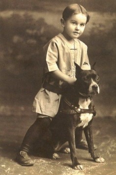 Vintage pic of an American Pitbull Terrier and a young boy, back when pitbull were considered nursery dogs.