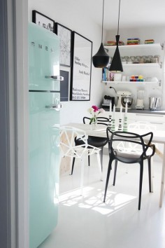 White, black and mint kitchen.