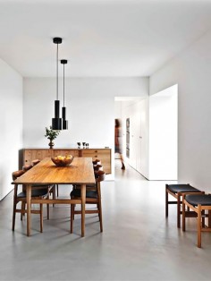 White clean minimalist dining room, love the concrete floor