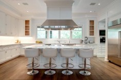 White leather barrel back counter stools with silver nailhead trim