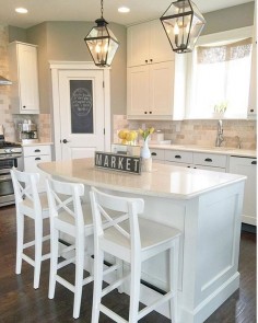 White transitional farmhouse kitchen. With IKEA stools & ceasarstone countertops.