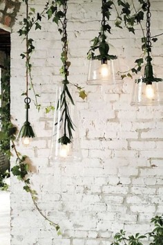 Whitewashed brick walls with drop lighting fixtures and plants - what more could one ask for?